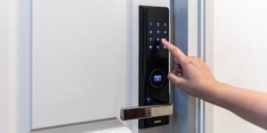 comparing smart lock options for pleasantville homeowners hand in keypad smart lock