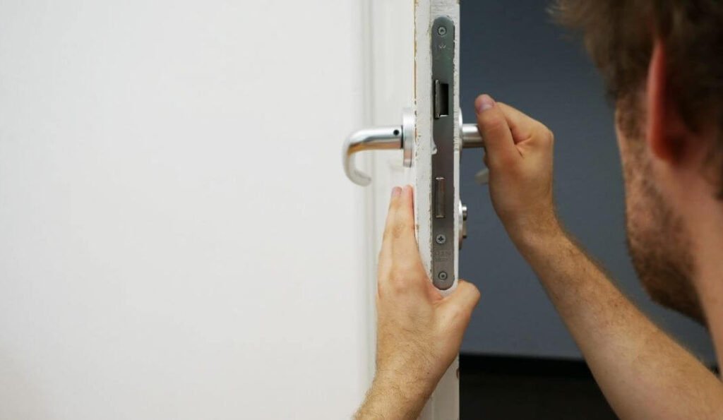 Locksmith checking door for issue