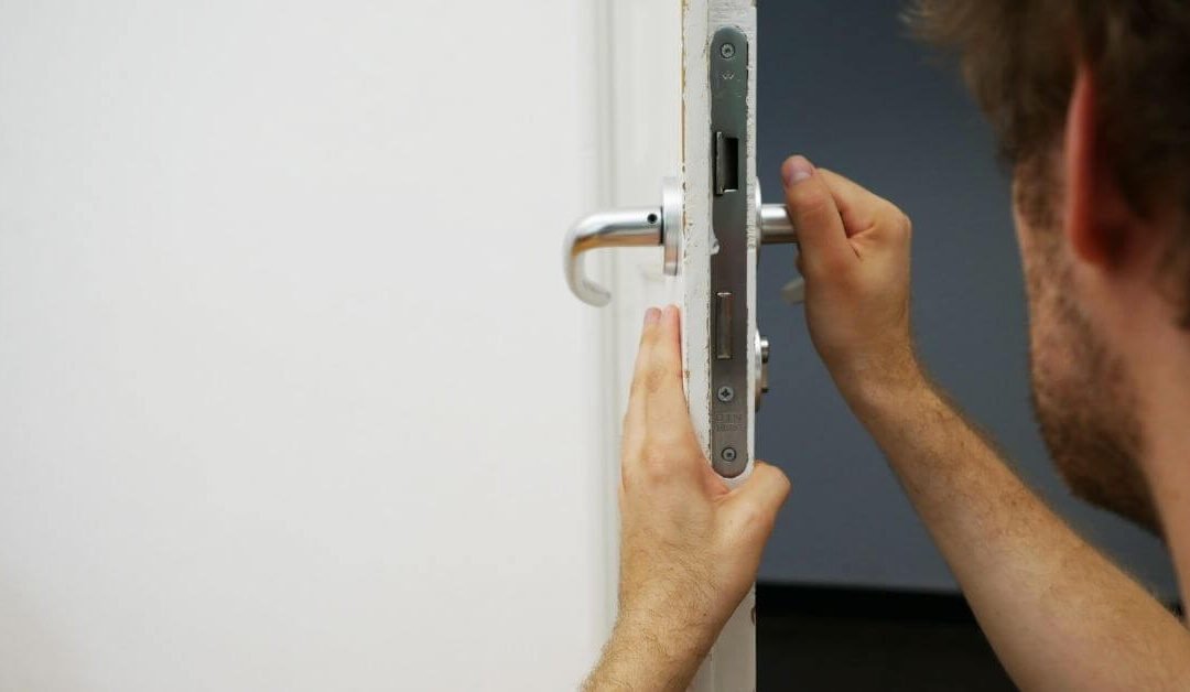 Locksmith checking door for issue