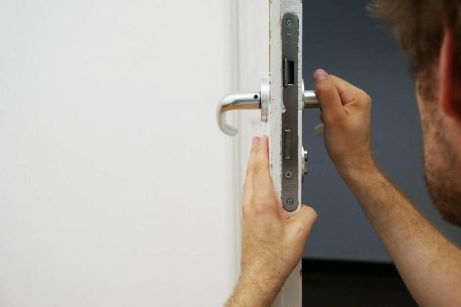 Locksmith checking door for issue
